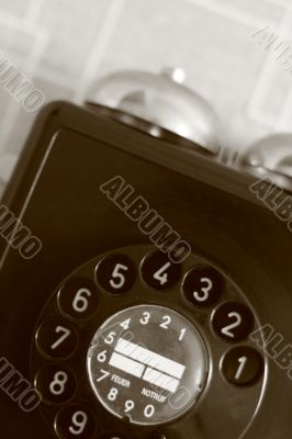 black retro telephone on white