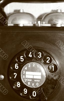 black retro telephone on white