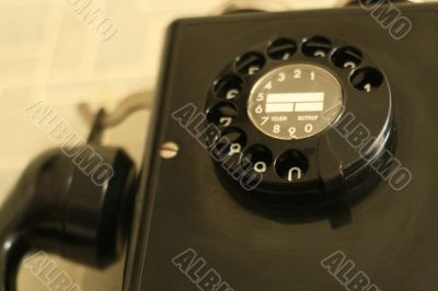 black retro telephone on white