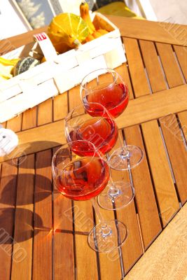 Rose wine on the wood table