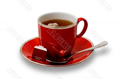 Isolated Full Red Teacup and Saucer with Teabag