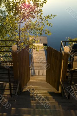 Open door of a ladder to lake