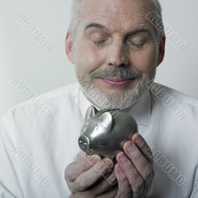 Man holding piggy bank