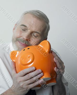 Man loving his piggy bank