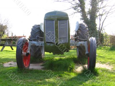Old Tractor in Green Field