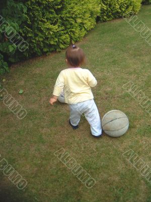 Toddler Playing Football