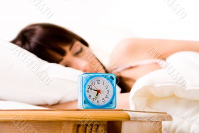 Alarmclock about to wake her up