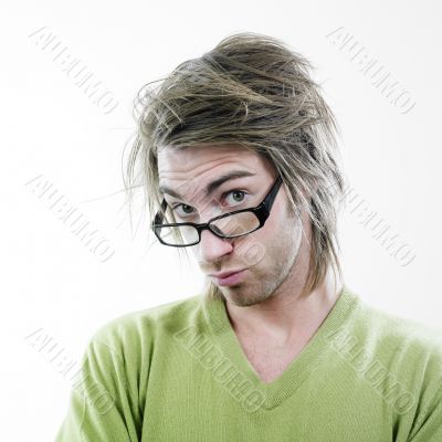 Man peering over eyeglasses