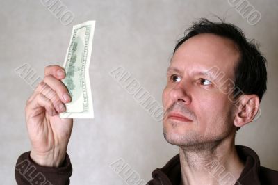 Checks dollars on authenticity