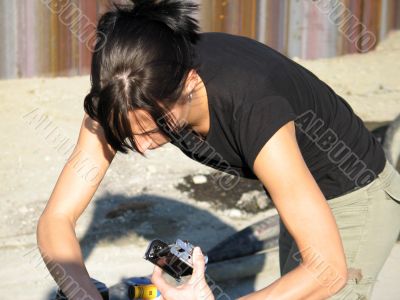 woman loading film in camera