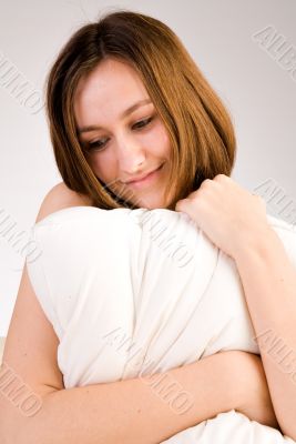 Hugging with her pillow