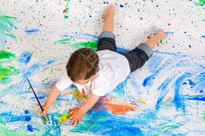 Boy playing with painting