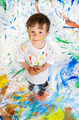 Boy playing with painting