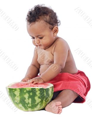 Baby eating watermelon