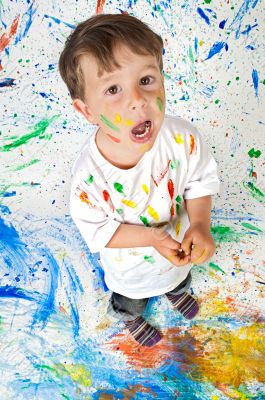 Boy playing with painting
