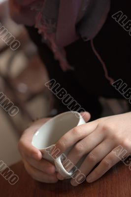 Woman hands with cup of coffee