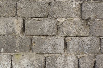 Wall from bricks with big cracks