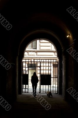 Girl and dog into arch