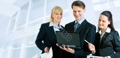 Three people working