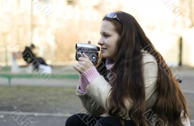 Woman with videocamera