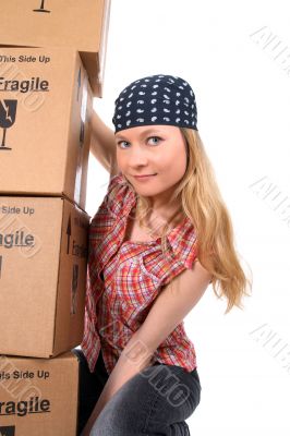 Portrait of a young woman with cardboard boxes