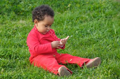 Baby playing on the grass