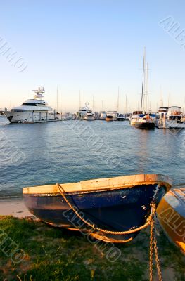 Blue Dinghy And Yachts