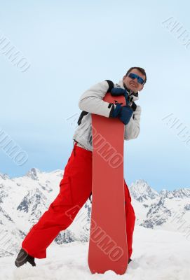 Man with red snowboard