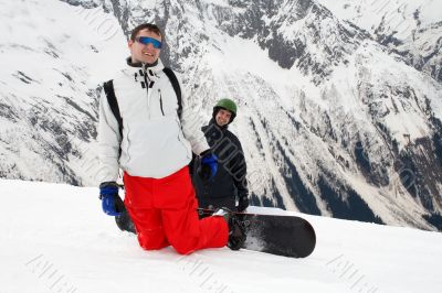 Two happy snowboarders