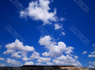 white clouds blue clear sky sun