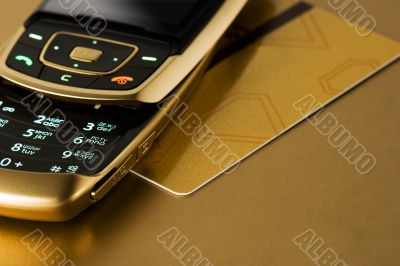 cell phone with gold credit card