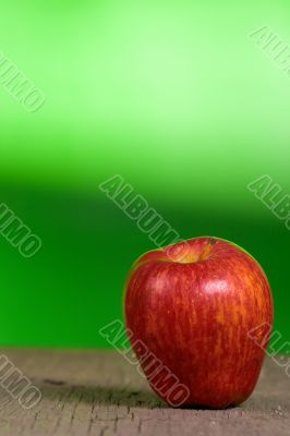 red apple with green background