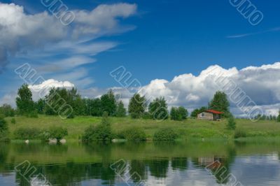 Small house on lake shore