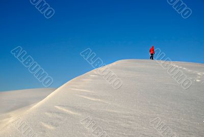 One man  trekking on a snow mountain.