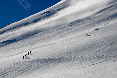 Five people trekking  on a mountain