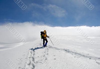 Lonely climber on  top of mountain
