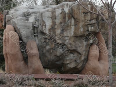 Hands Holding Rock