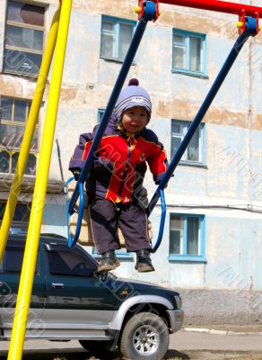 The Boy on seesaw.