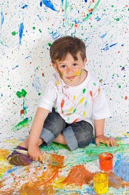 Boy playing with painting