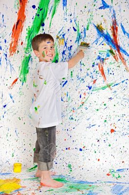 Boy playing with painting