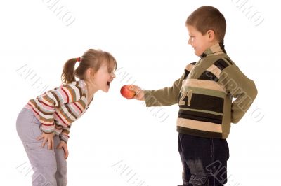 Two children and an apple