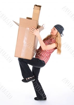 Girl balancing with cardboard boxes