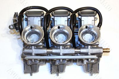 3 carburetors of a motorbike