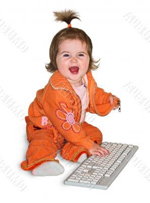 Baby girl playing with computer keyboard