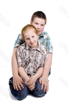 young boy is protecting little girl
