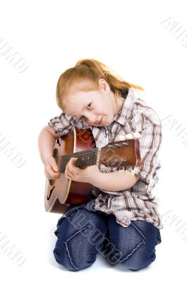 little girl playing on a guitar