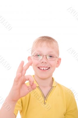 Smiling teenager showing OK sign.