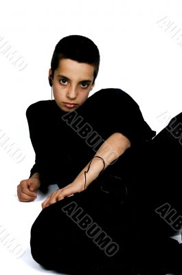 teenage boy laying on floor listening to music