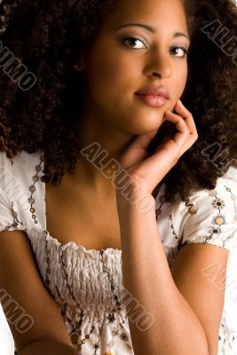 African woman with a hand on her chin