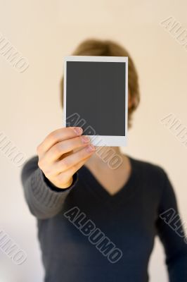 woman holding empty card in front